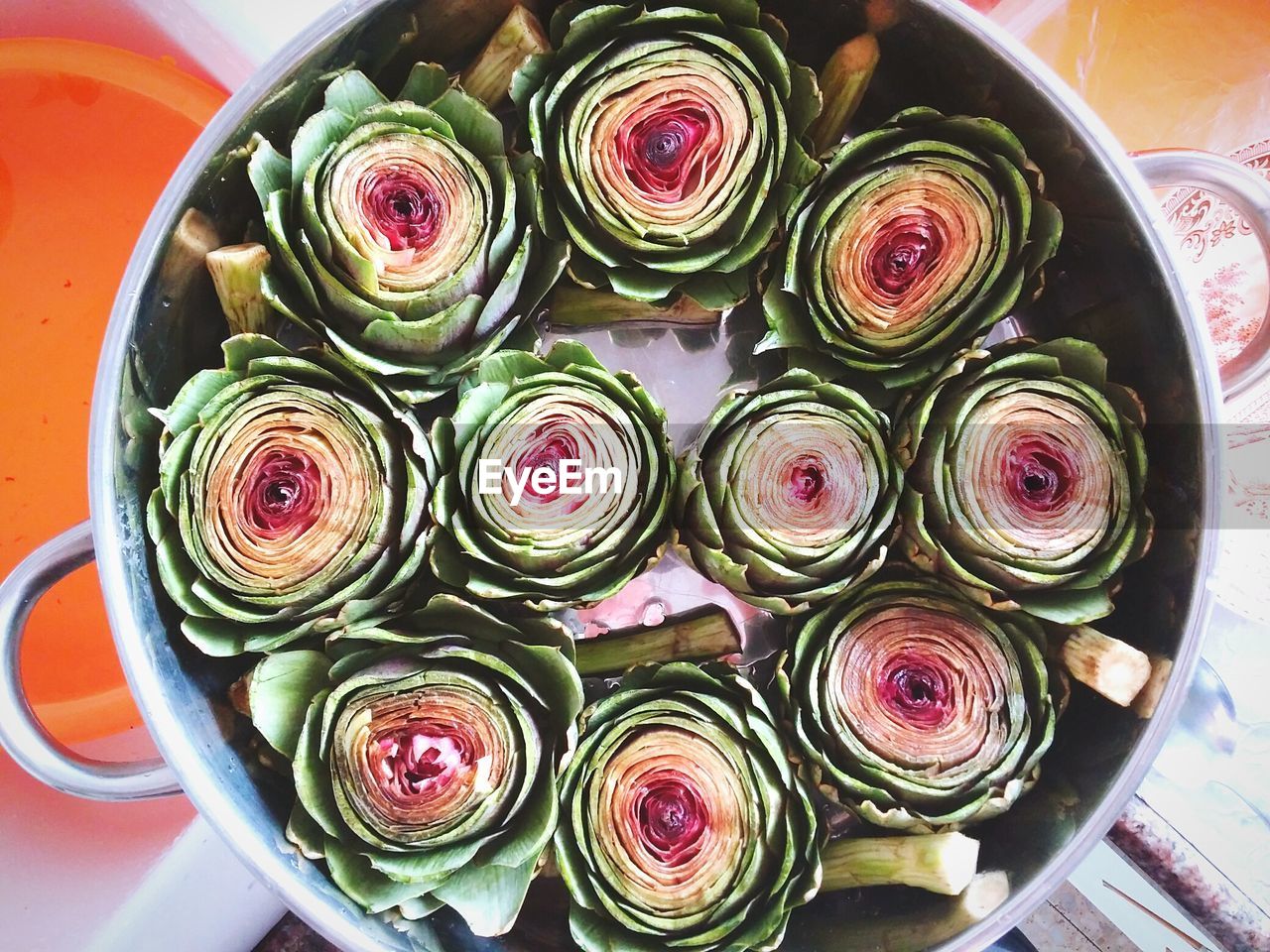 Directly above shot of artichoke vegetables in utensil