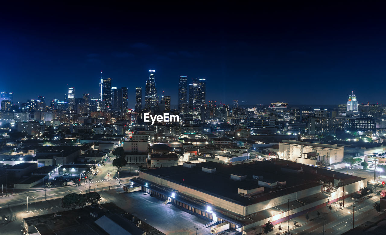 High angle view of illuminated buildings in city at night