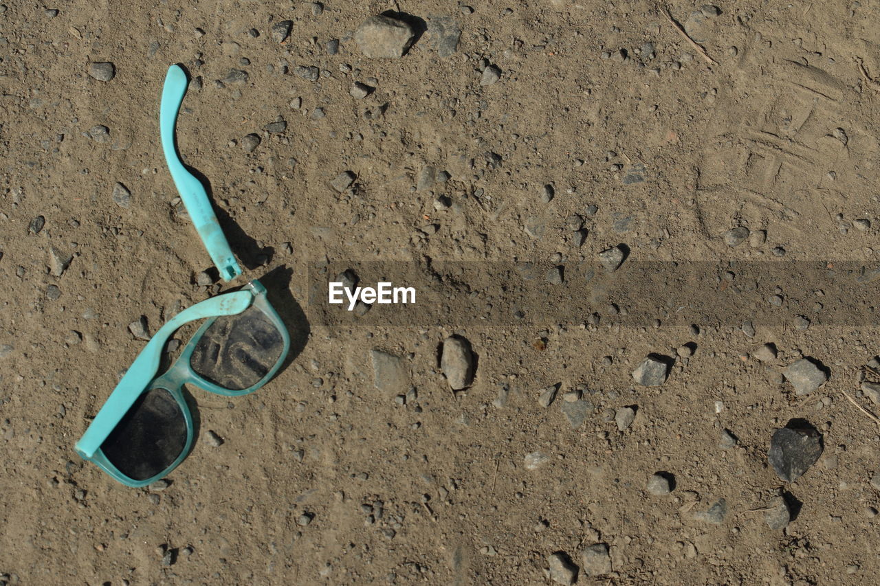 High angle view of broken sunglasses