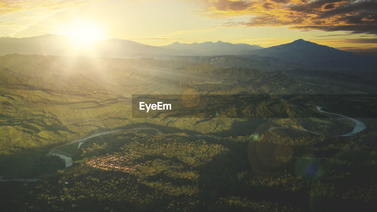 SCENIC VIEW OF LANDSCAPE AGAINST SKY AT SUNSET