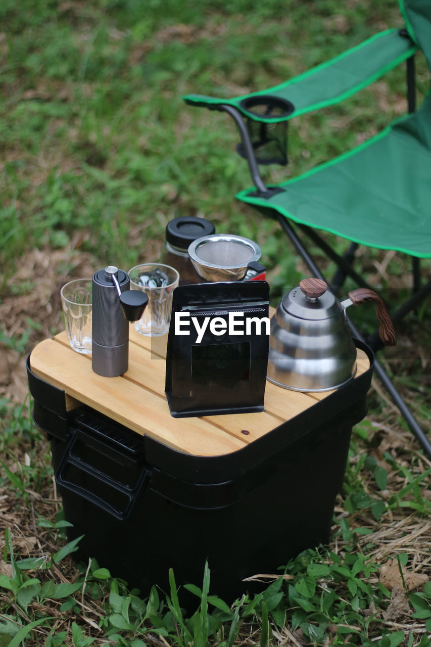 High angle view of vintage coffee set on field
