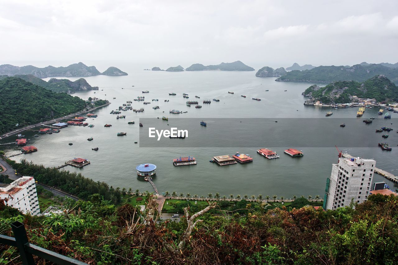 High angle view of boats in sea against sky