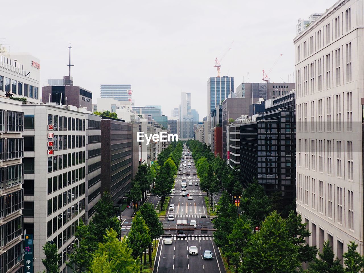 High angle view of buildings in city against sky