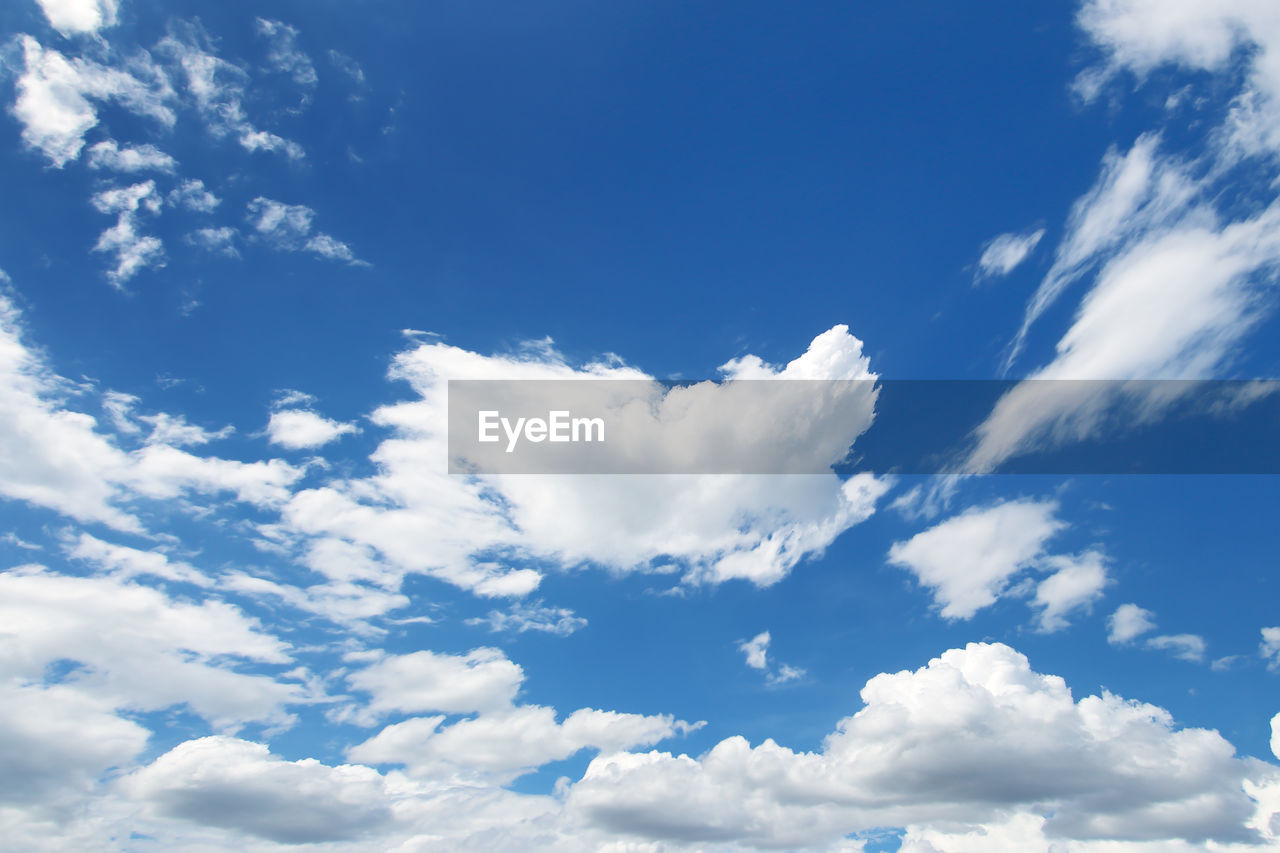 sky, cloud, daytime, blue, cloudscape, environment, nature, backgrounds, white, beauty in nature, idyllic, scenics - nature, atmosphere, no people, tranquility, wind, outdoors, fluffy, overcast, dramatic sky, sunlight, summer, day, azure, landscape, bright, tranquil scene, high up, light - natural phenomenon, vibrant color, flying, copy space, climate, meteorology, religion, low angle view, horizon