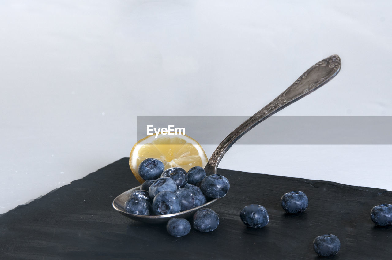 CLOSE-UP OF FRUITS ON TABLE