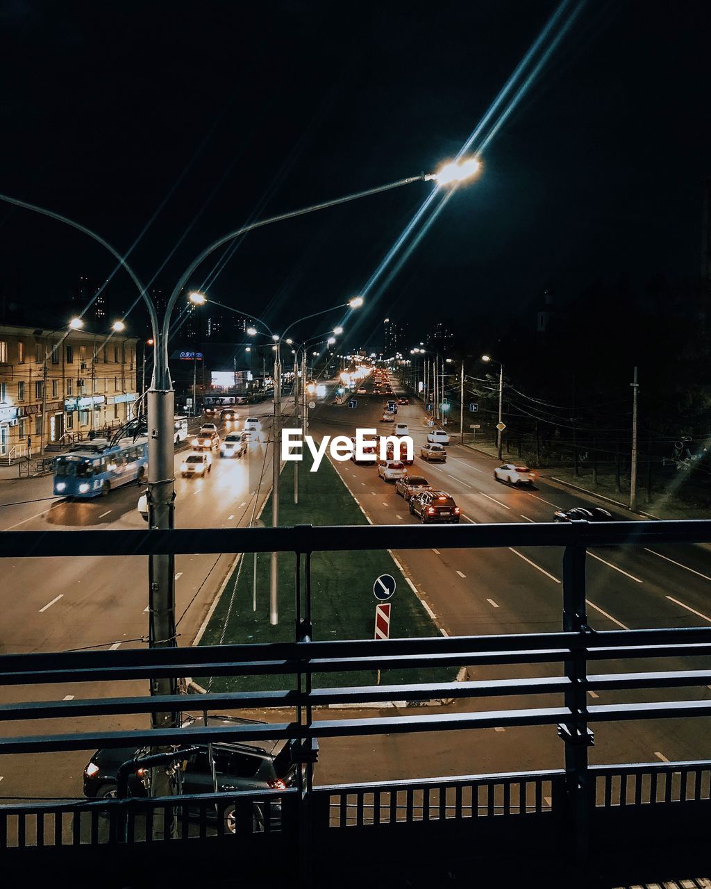 LIGHT TRAILS ON ROAD AT NIGHT