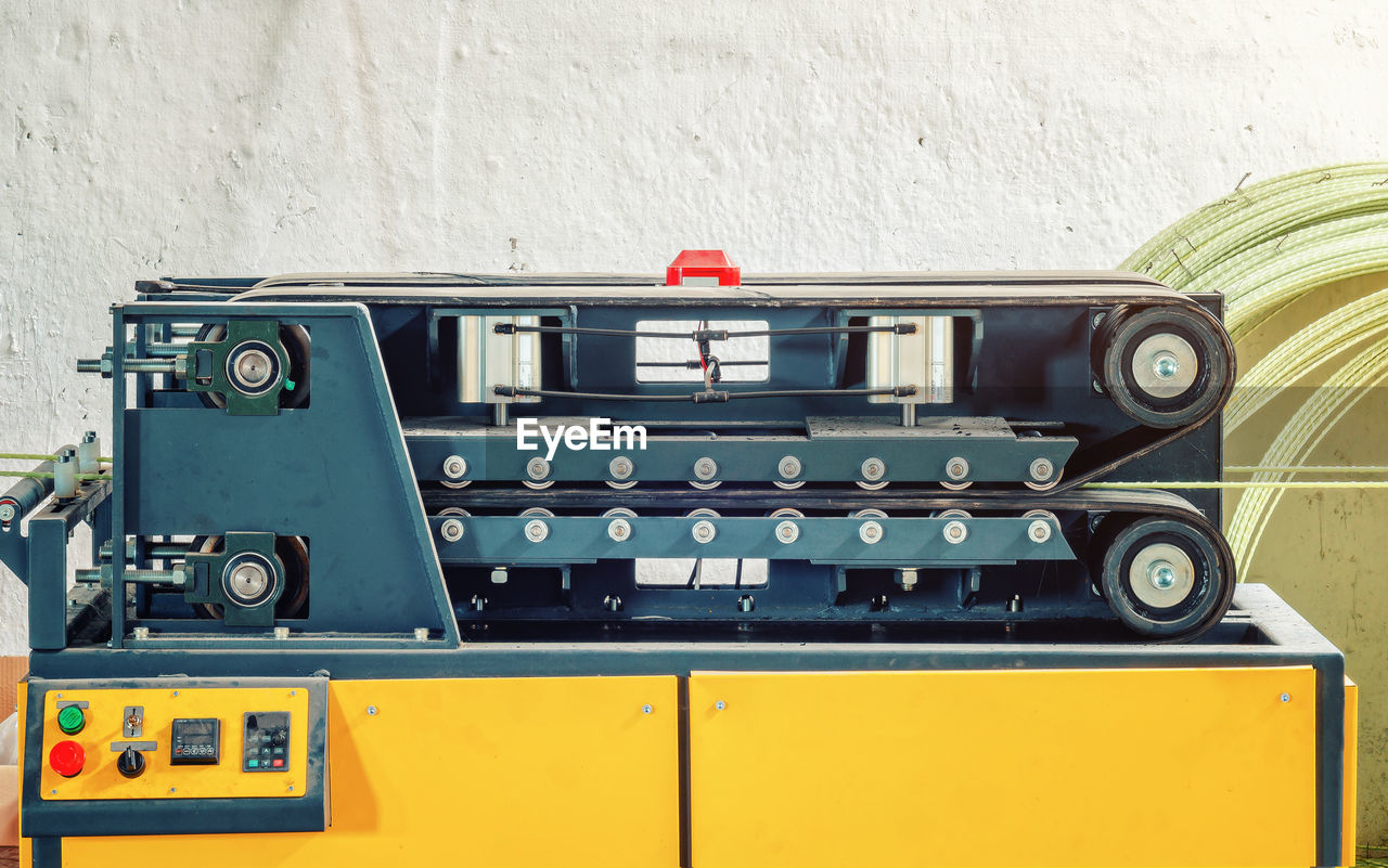 technology, no people, retro styled, vehicle, yellow, wall - building feature, old, equipment, indoors, transport, music