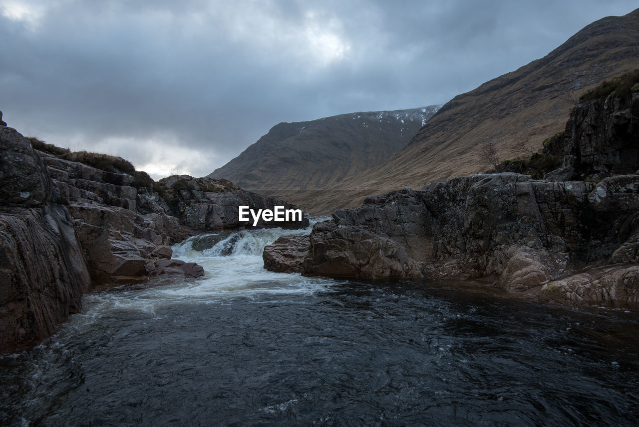 Scenic view of mountains against sky during winter