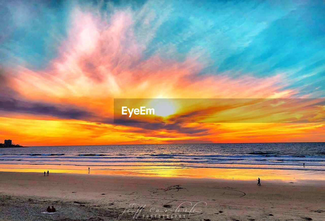 SCENIC VIEW OF BEACH DURING SUNSET