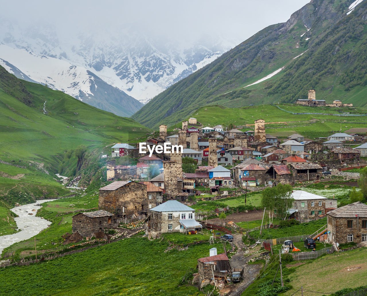 AERIAL VIEW OF TOWNSCAPE BY MOUNTAINS