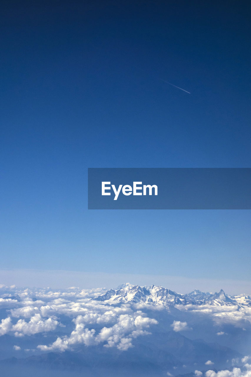 Scenic view of clouds over mountain