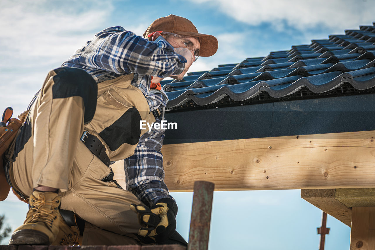 Low angle view of man against sky