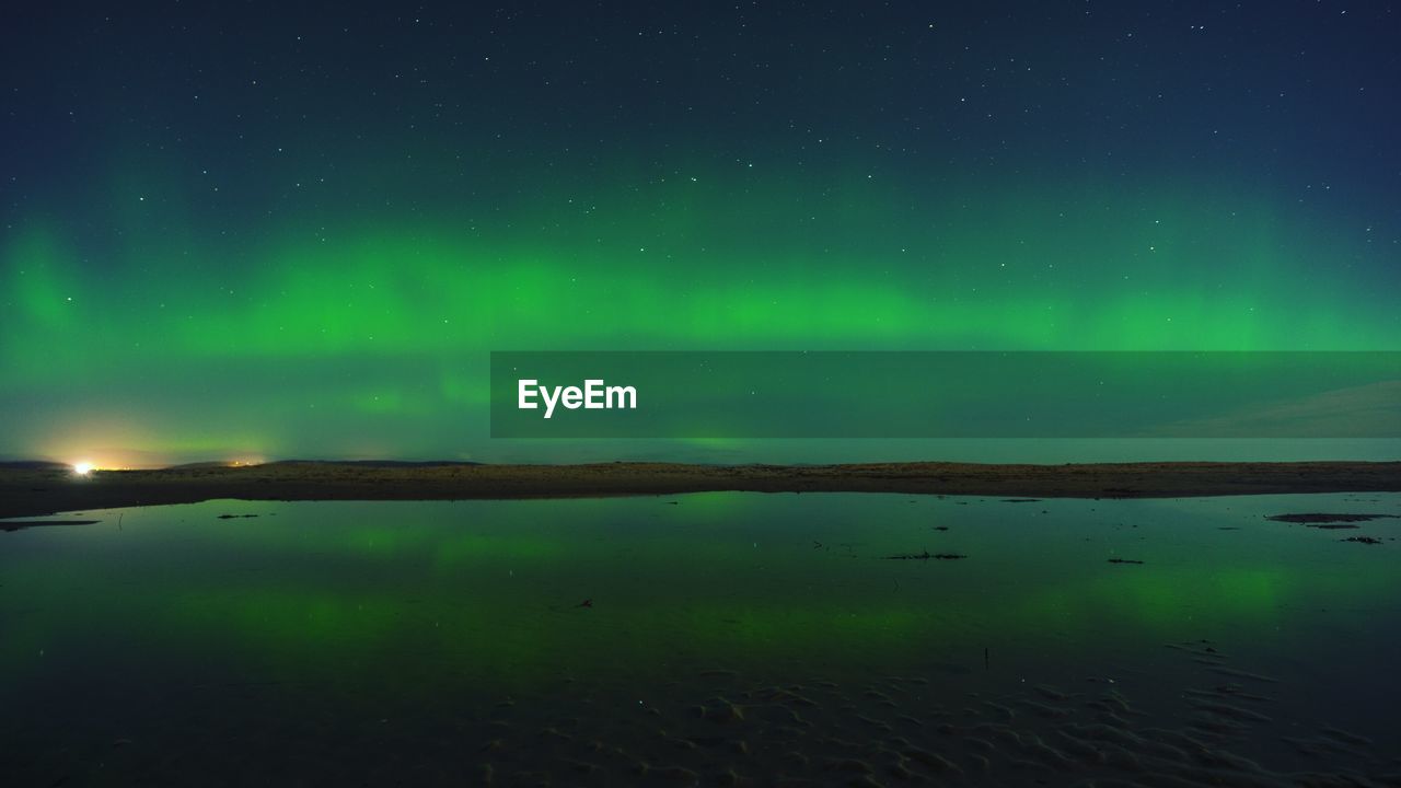 Aurora polaris against sky at night