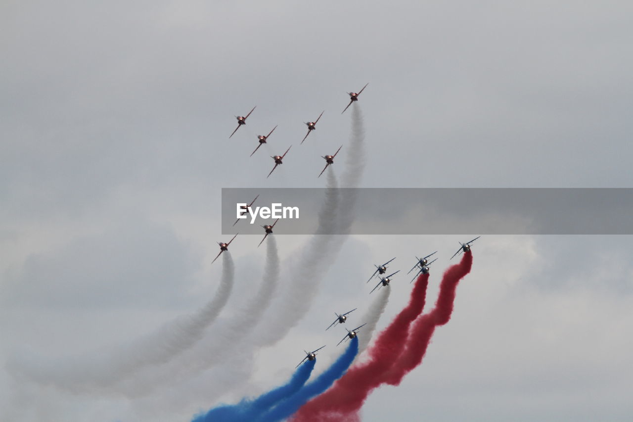 LOW ANGLE VIEW OF AIRPLANE FLYING IN SKY