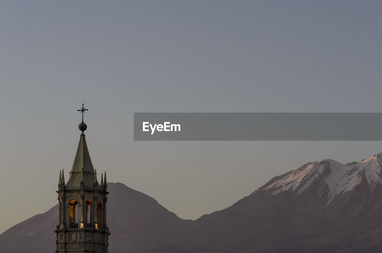 Basilica cathedral of arequipa against mountains at dusk