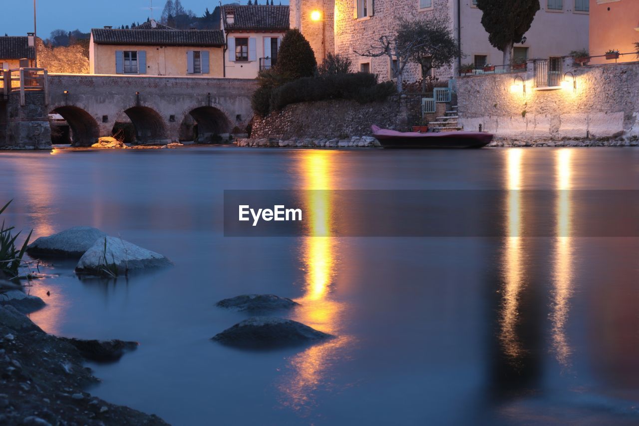 REFLECTION OF ILLUMINATED BUILDINGS IN WATER