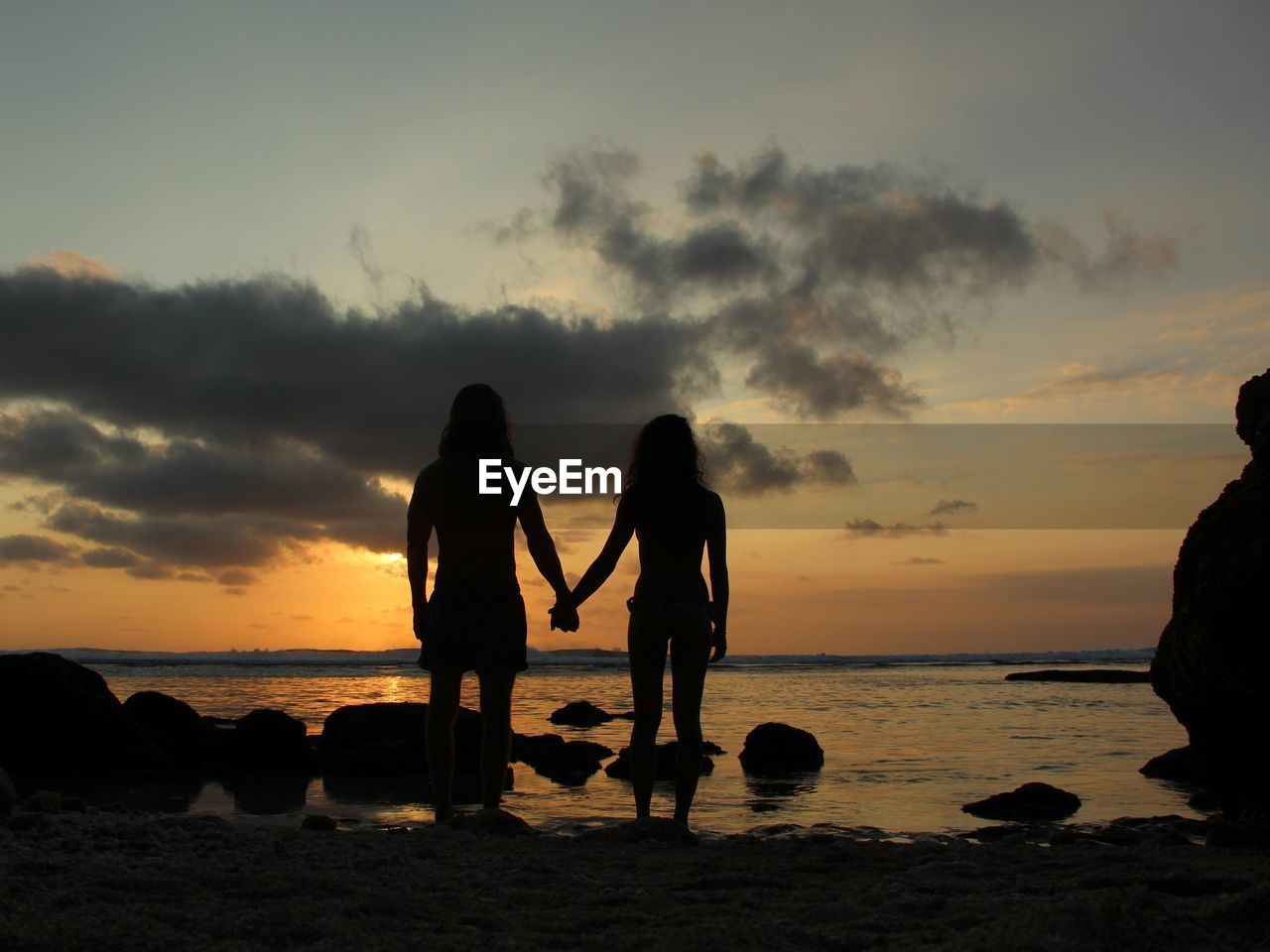 SILHOUETTE PEOPLE AT BEACH DURING SUNSET