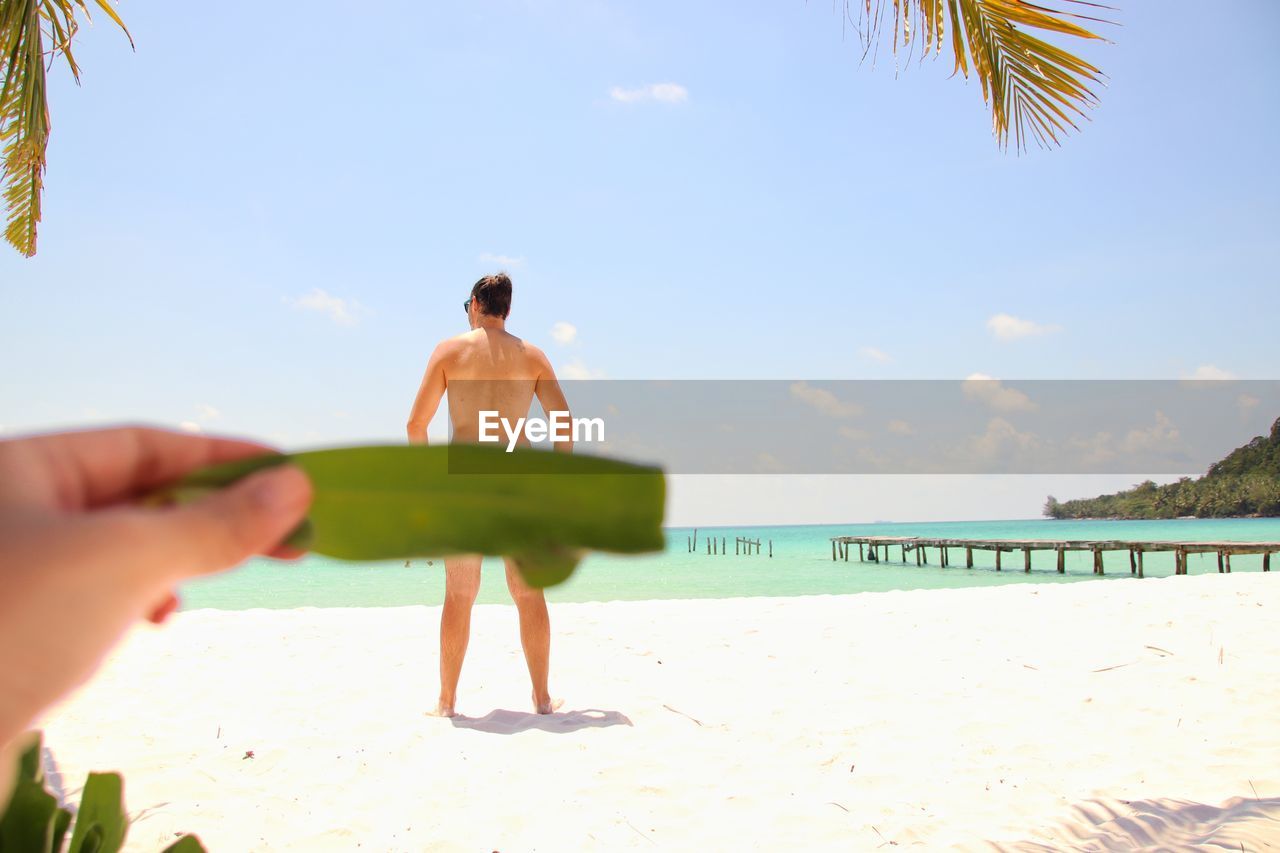 One person posing on beach