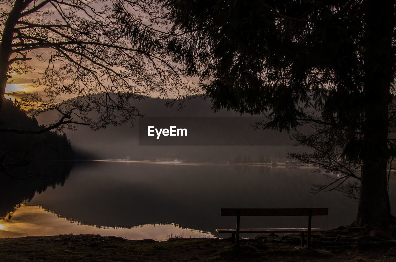 SCENIC VIEW OF LAKE AT SUNSET