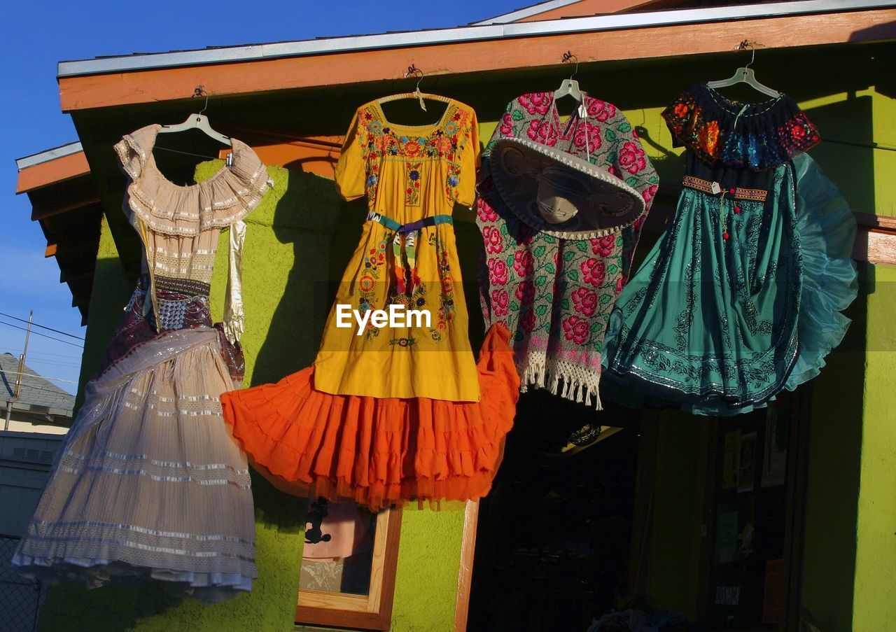 Low angle view of clothes hanging at store