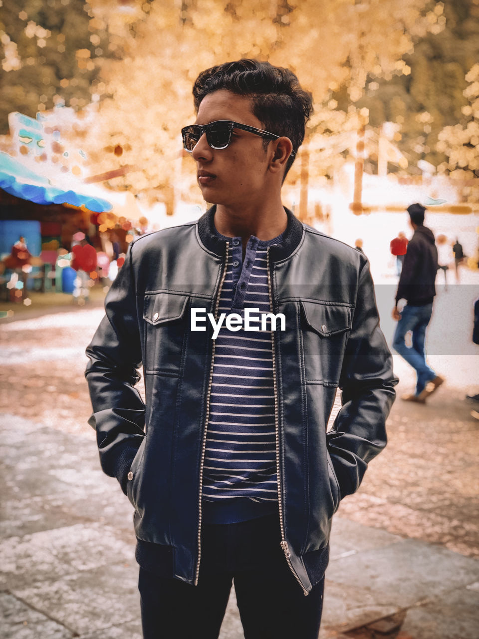 Young man wearing sunglasses standing outdoors