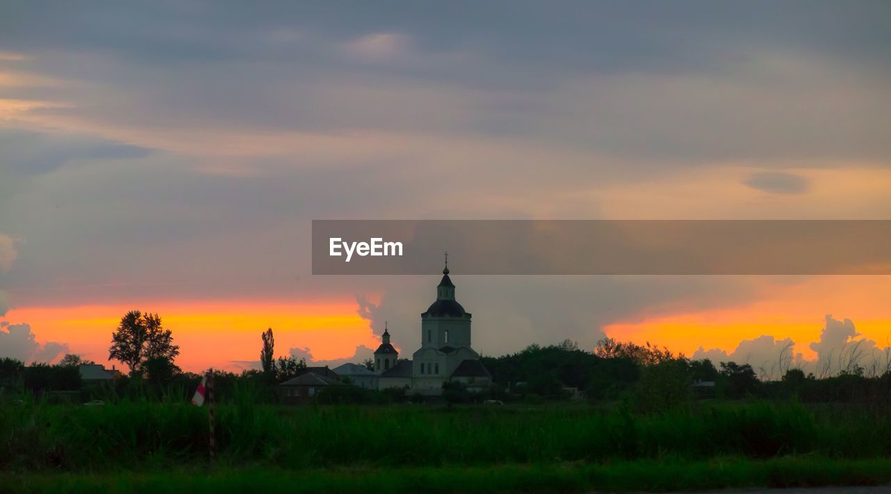 Scenic view of landscape against cloudy sky