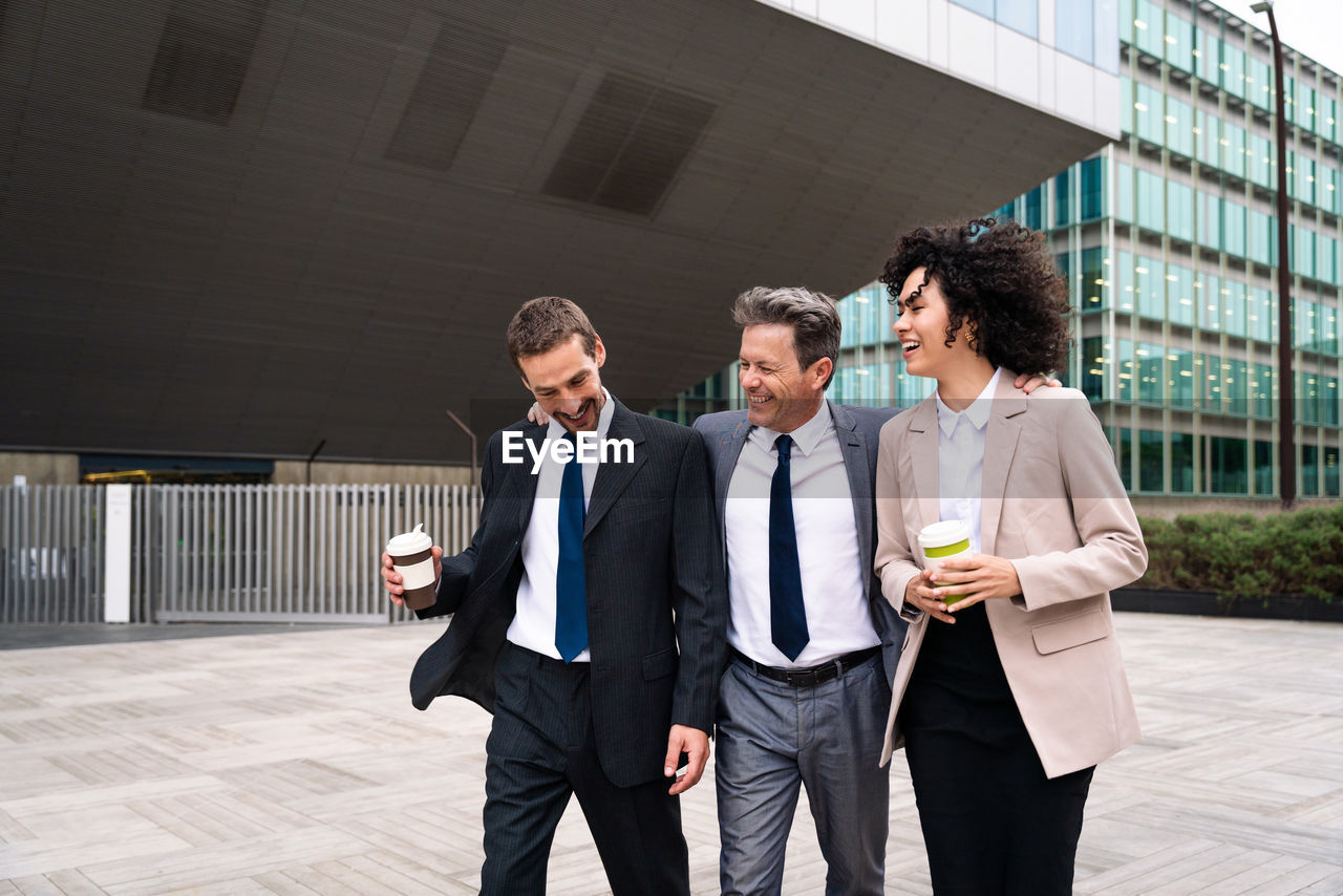 business colleagues standing in office city