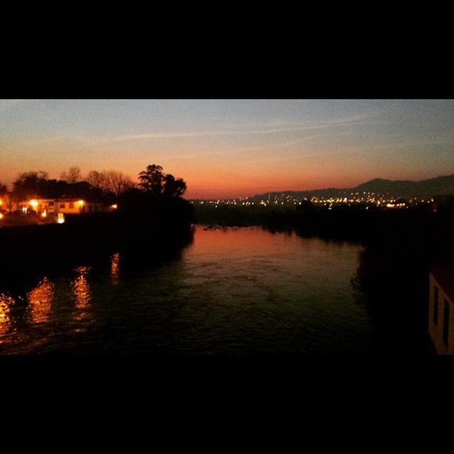 VIEW OF RIVER AT SUNSET