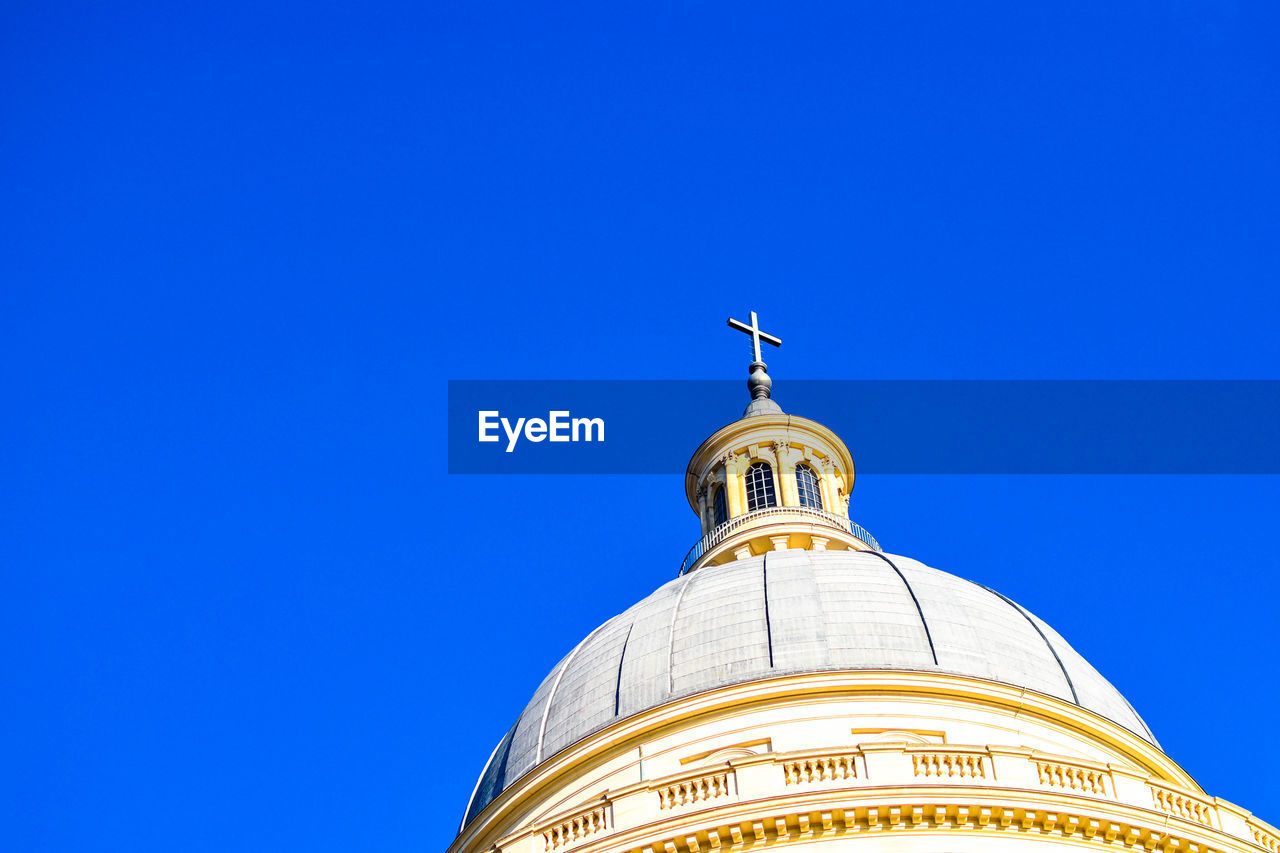 Low angle view of a building against blue sky