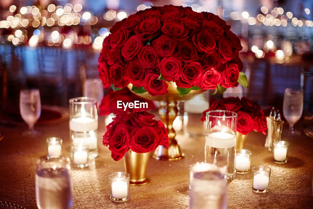 Close-up of red roses on table
