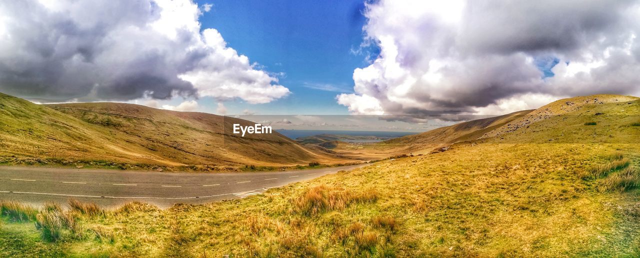 Panoramic view of irish landscape with blue sky. connors pass county kerry looking south. ireland.