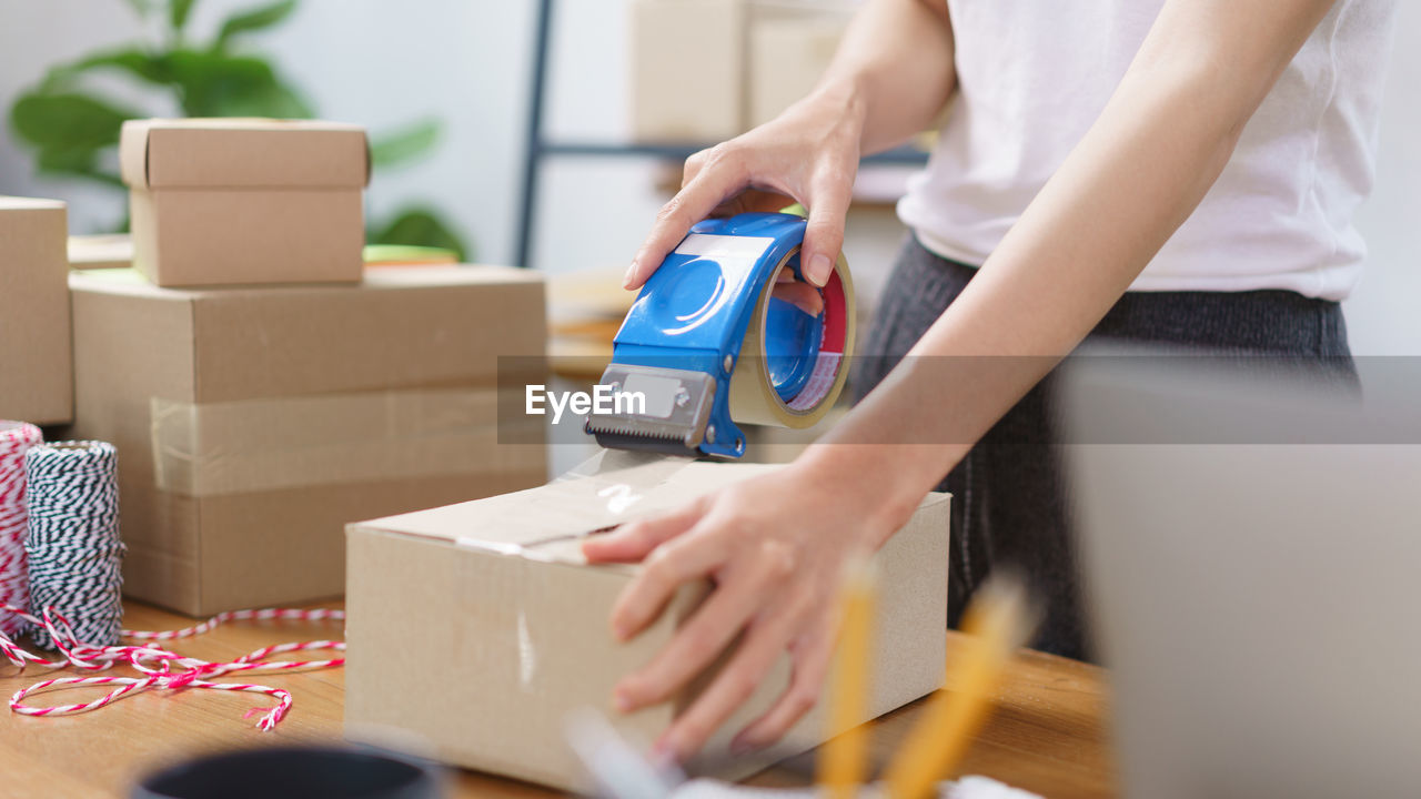 midsection of man using laptop