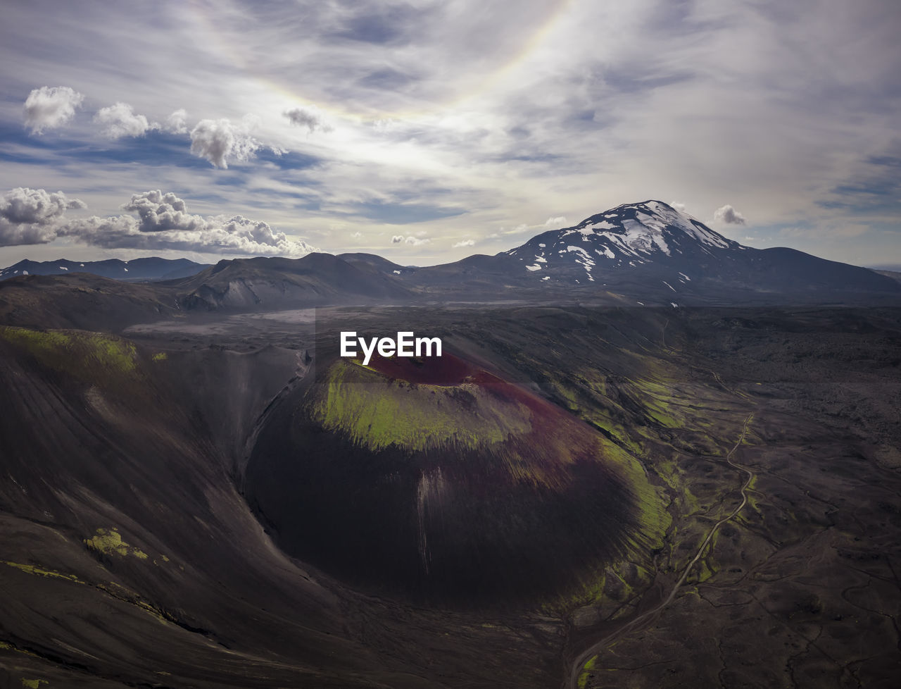 Aerial view of rough volcanic crater located in amazing highlands on cloudy day in iceland