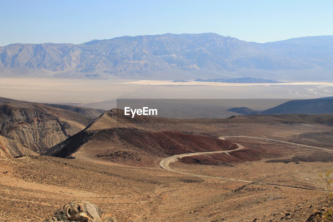 Scenic view of landscape and mountains against sky