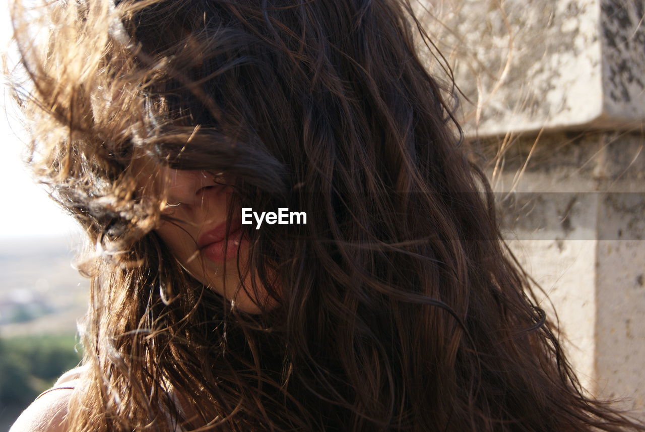 Portrait of woman with tousled hair