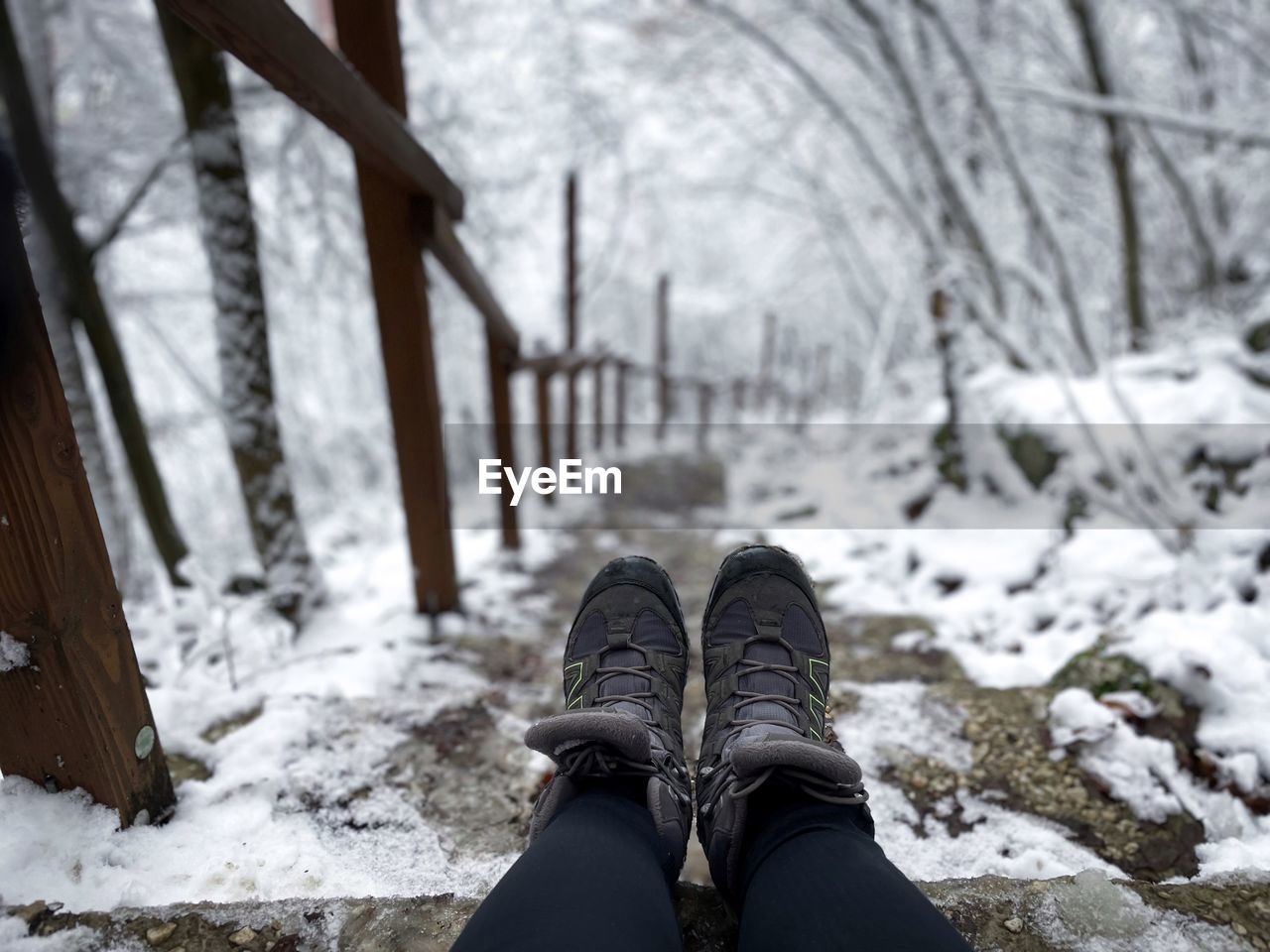 Hiking boots and steps covered in snow