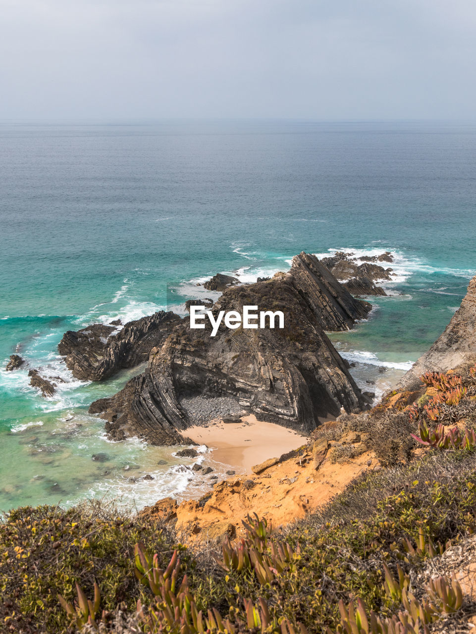 High angle view of sea shore against sky