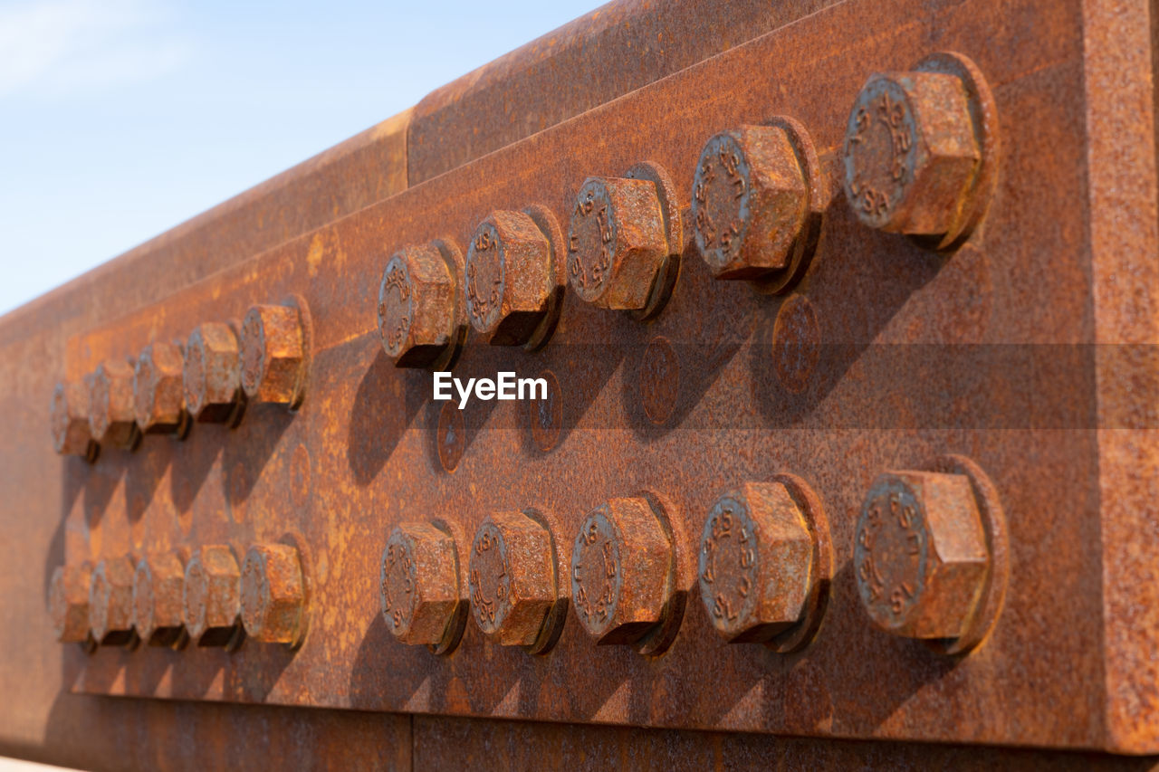 Close-up of industrial bolts / screws and metal installation