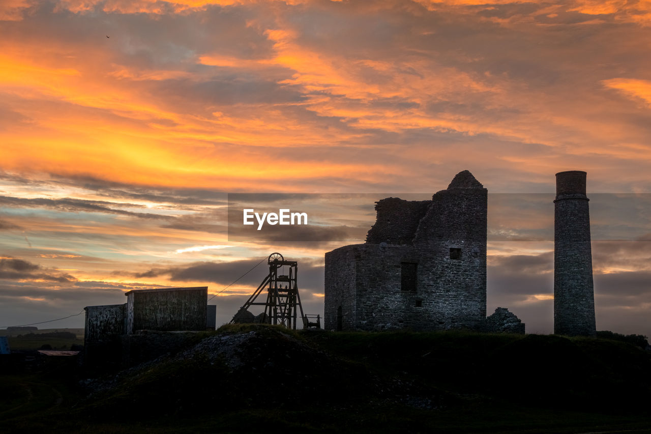 Buildings against sky during sunset