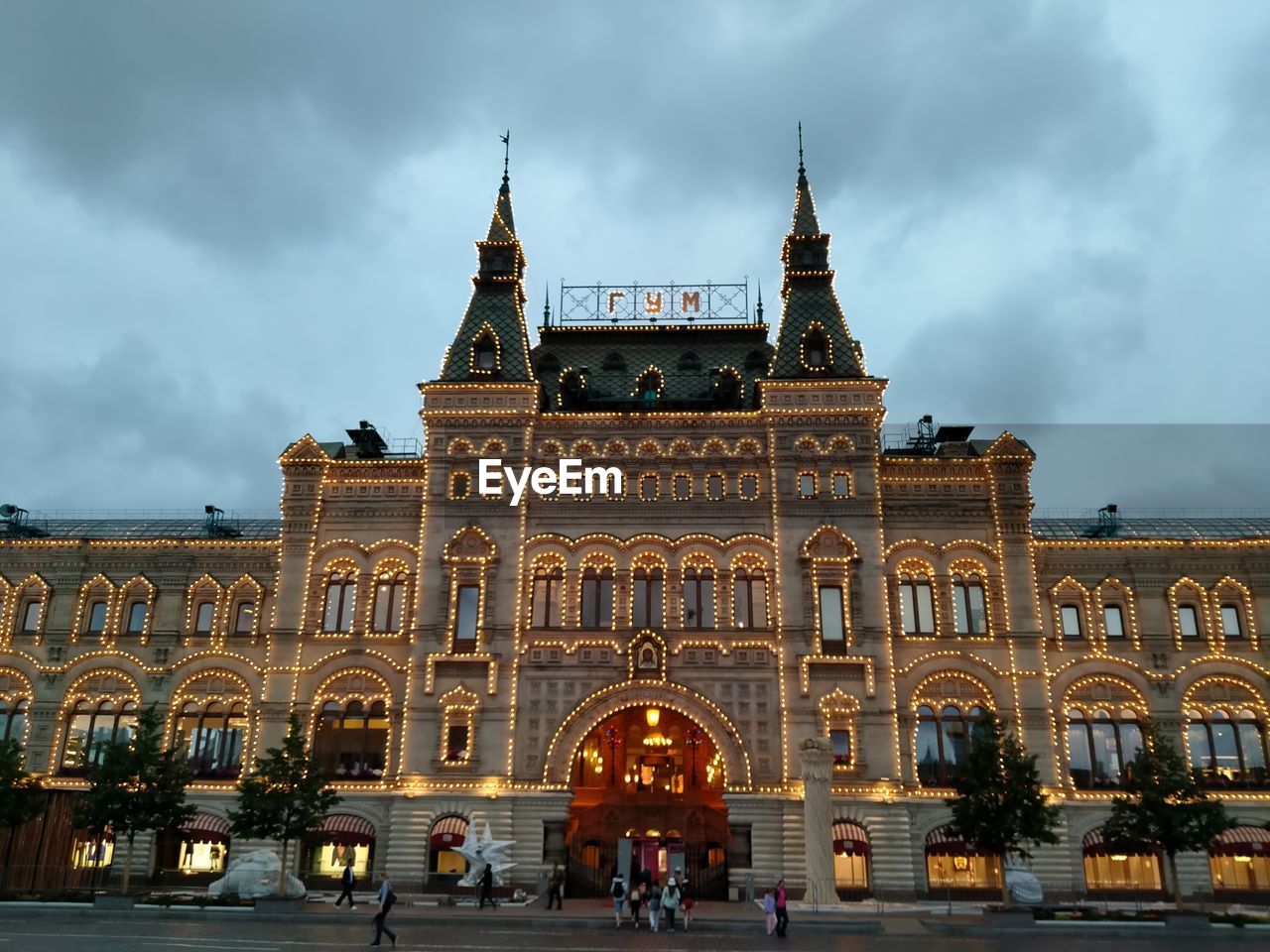 VIEW OF BUILDING AT DUSK