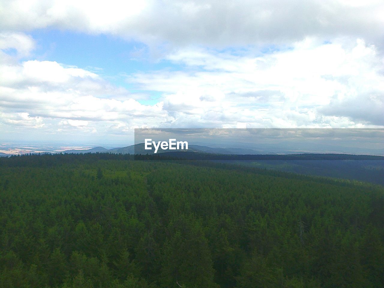 SCENIC VIEW OF MOUNTAINS AGAINST CLOUDY SKY