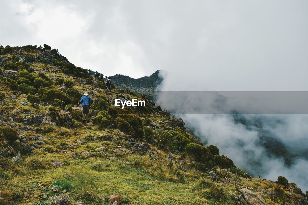 Volcanic rock formations against a foggy mountain background, aberdare ranges, kenya