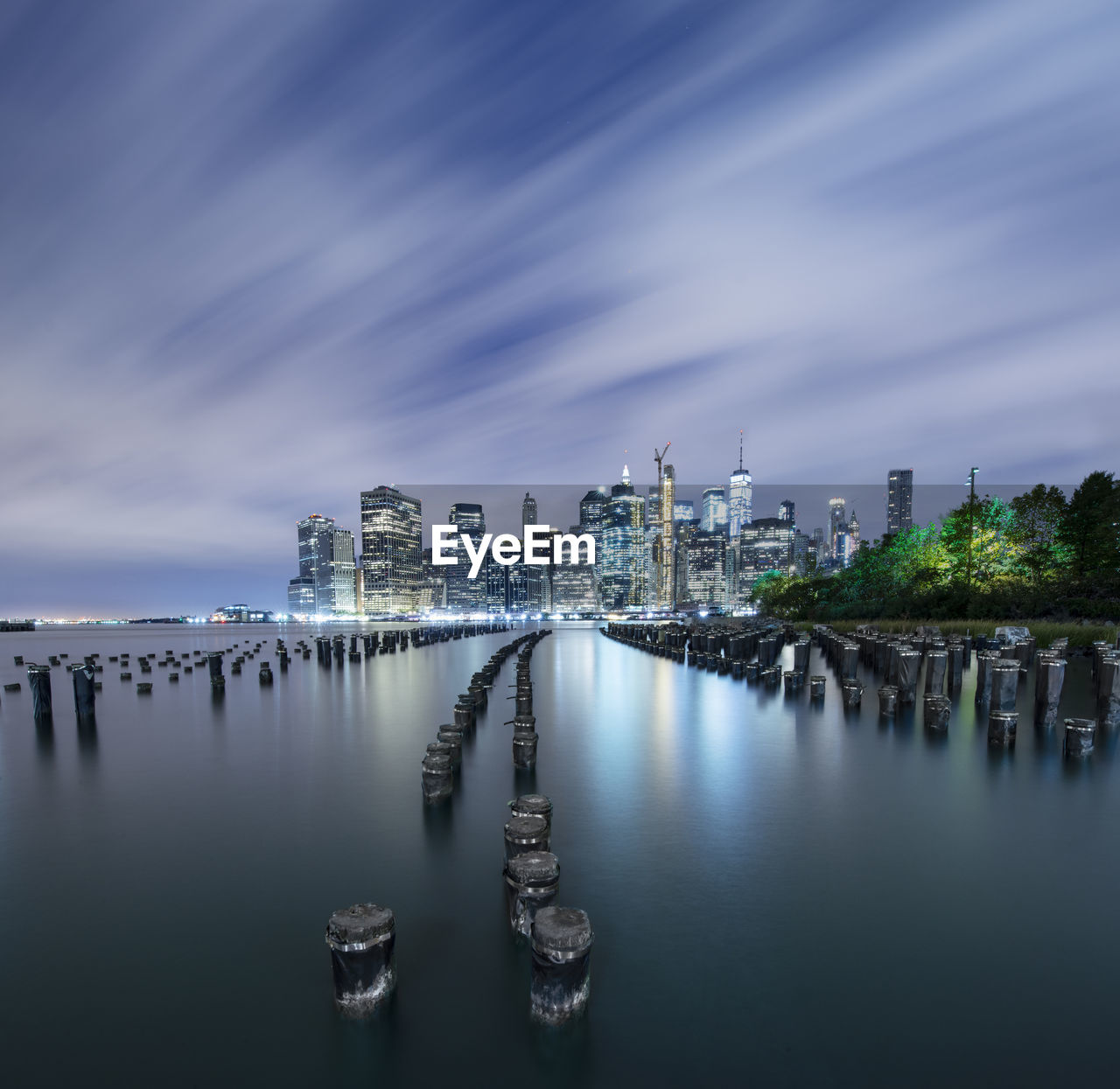 Manhattan glows across east river nyc