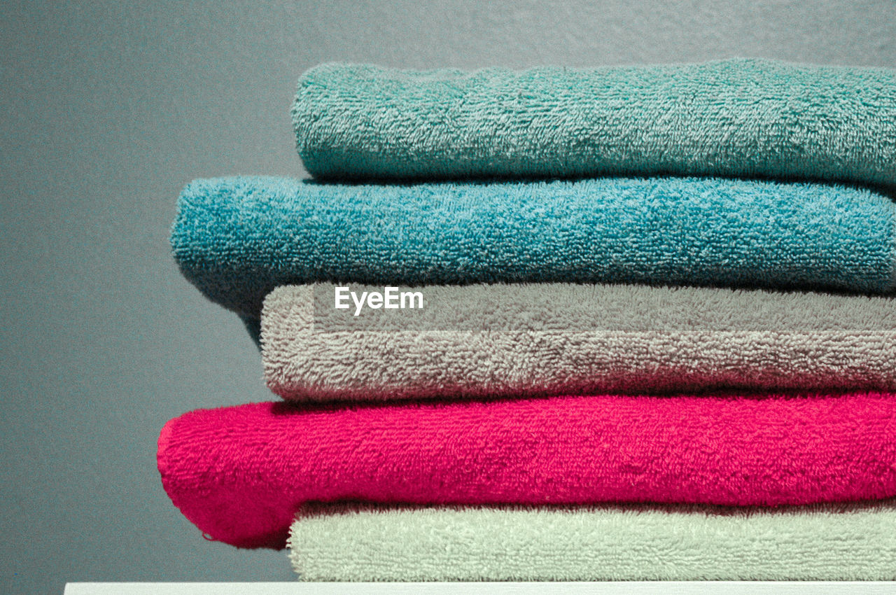 Close-up of stacked towels on table