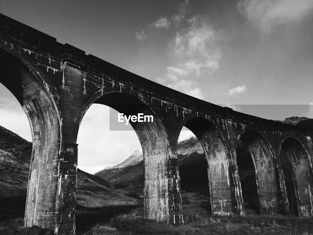 Low angle view of arched bridge against sky