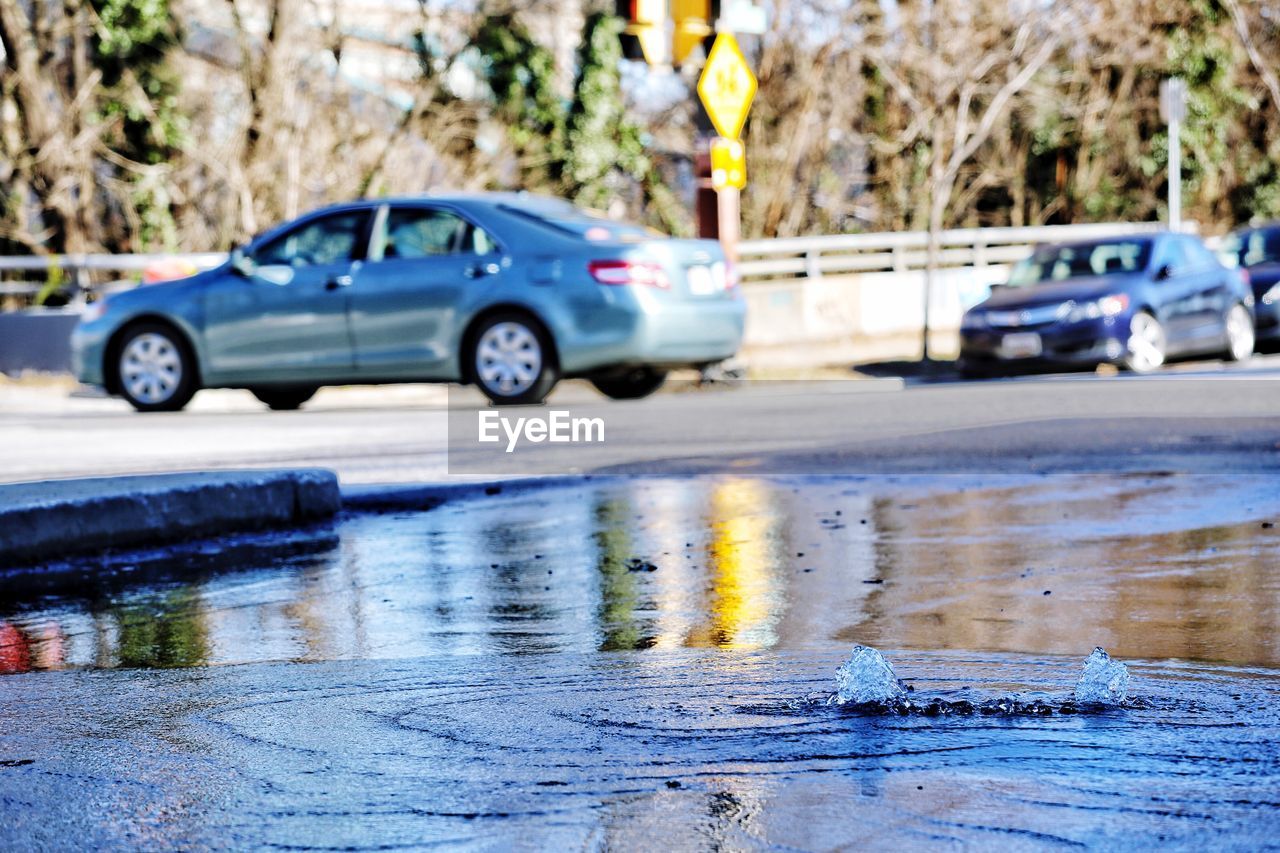 CARS ON ROAD IN RAIN