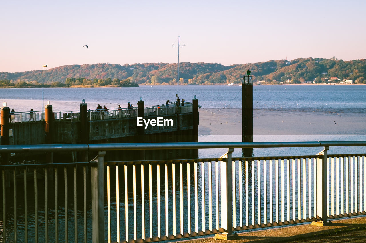 SCENIC VIEW OF RIVER AGAINST SKY DURING SUNSET