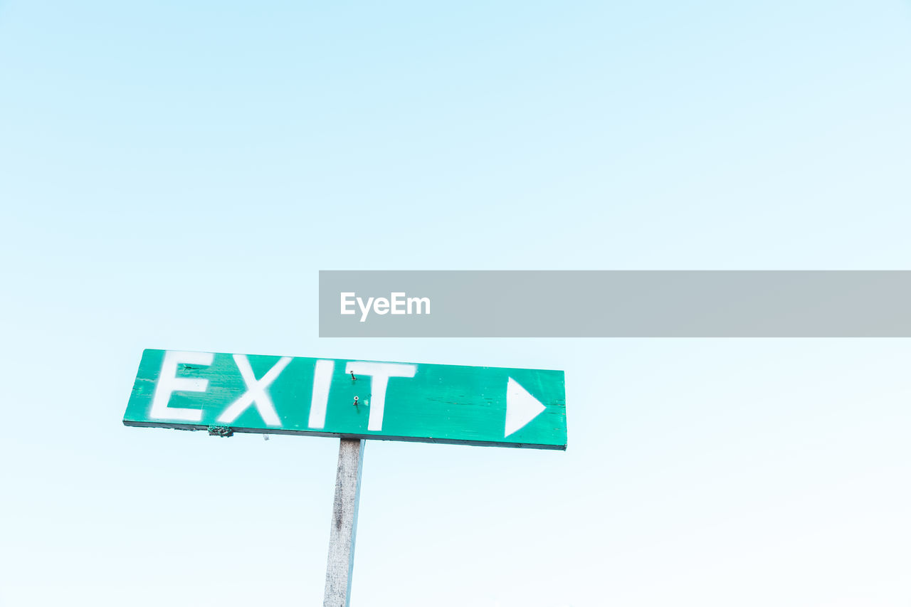 Exit Exit Sign Green Green Color Clear Sky Copy Space Low Angle View Road Sign Clear Sky Guidance Direction Single Object Exit Sign Arrow Symbol Sky Green Color Rules Warning Warning Sign Directional Sign