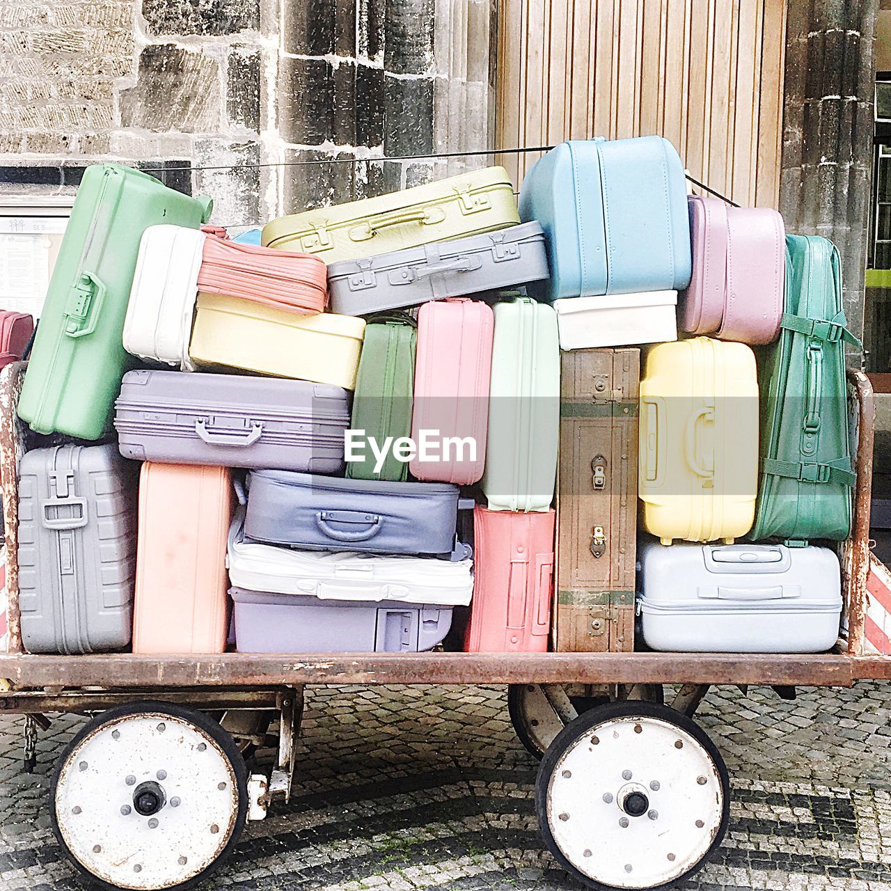 Multi colored luggage on cart