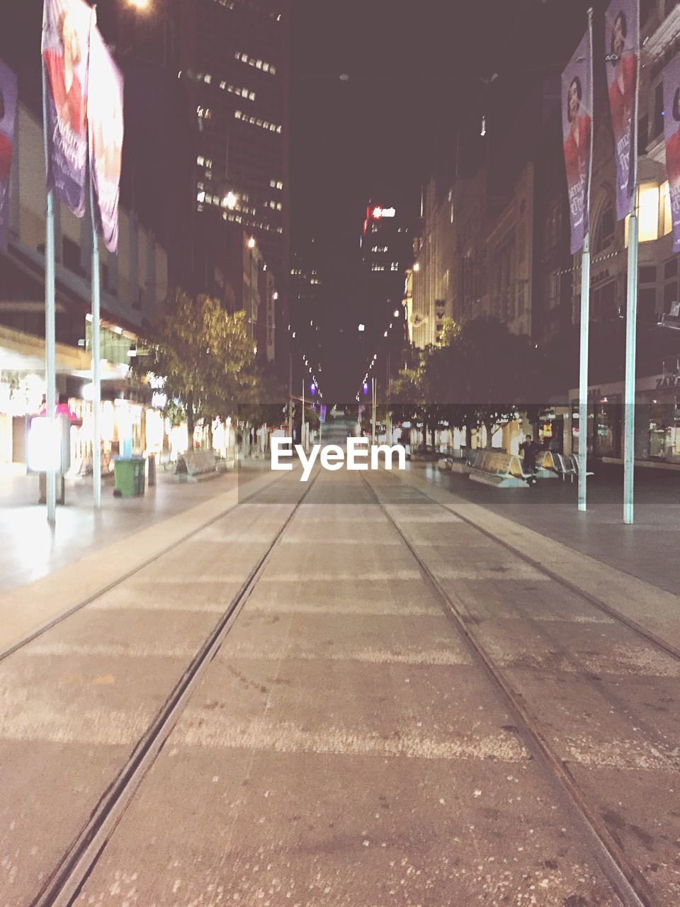 VIEW OF CITY STREET AT NIGHT